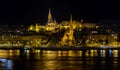 View of the evening Budapest from a pleasure boat. Buda in the evening illumination. Night city. Danube river at night. Walk and Royalty Free Stock Photo