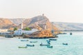 View of fishing boats anchoring in a bay in the Omani town Al Ayjah