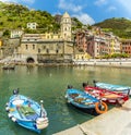 A view of fishing boats lined up along the quayside in the picturesque village of Vernazza Royalty Free Stock Photo