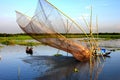 View of fishing with a net in flooded water in Manikganj, Bangladesh