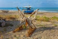 A view of a fishing net in front of the boat on the beach. Beautiful calm sea and water during an hot summer day Royalty Free Stock Photo