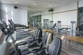 View of fitness room with many exercise equipment