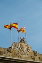 View of the flags of Barcelona, Catalonia and Spain flutter in the wind on the roof over the City Council of Barcelona. Barcelona Royalty Free Stock Photo