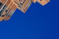 View from the floor of the facade of a modern building clad in ecological wood over clean blue sky, concept of sustainable Royalty Free Stock Photo