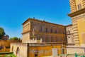 View of Florence from Boboli gardens. Boboli gardens in Florence, a couple walking in an arched path. View of the Palazzo Pitti in Royalty Free Stock Photo