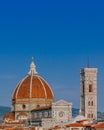 Florence Cathedral and Giotto`s Bell Tower under blue sky, over houses of the historical center of Florence, Italy Royalty Free Stock Photo