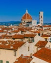 Florence Cathedral and Giotto`s Bell Tower under blue sky, over houses of the historical center of Florence, Italy Royalty Free Stock Photo