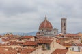 Florence Cathedral and Giotto`s Bell Tower, under overcast sky, over houses of the historical center of Florence, Italy Royalty Free Stock Photo