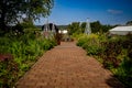 View of the Flower Garden, an English cottage-style garden, featuring allium, peony, clematis,