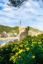 View from the flower garden to the tower of Tossa de Mar in Spain, Costa Brava
