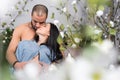 View from flowers on cute international couple of man with bare Royalty Free Stock Photo