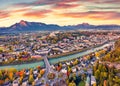 View from flying drone. Aerial cityscape of Salzburg, Old City. Spectacular autumn sunrise on Eastern Alps. Fantastic morning land Royalty Free Stock Photo