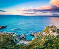 View from flying drone. Aerial morning view of Pool Of Venus. Colorful spring scene of Milazzo peninsula. Great sunrise on Sicily,