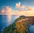 View from flying drone. Aerial spring view of Milazzo lighthouse. Fantastic morning scene of Milazzo peninsula. Stunning sunrise o