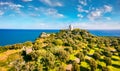 View from flying drone. Aerial spring view of Milazzo lighthouse. Picturesque morning scene of olive garden on Milazzo peninsula,