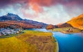 View from flying drone. Amazing autumn scene of Silvaplana village, Maloja Region. Aerial morning view of Swiss Alps. Spectacular