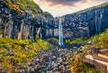 View from flying drone. Amazing morning view of famous Svartifoss Black Fall Waterfall. Breathtaking summer scene in Skaftafell, Royalty Free Stock Photo