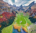 View from flying drone. Amazing morning view of Seealpsee lake. Breathtaking autumn scene of Swiss Alps. Santis peak reflected in Royalty Free Stock Photo