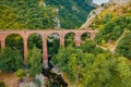 View from flying drone of ancient bridge across the Devil`s Throat Gorge, San Severino village location.