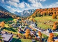 View from flying drone. Astonishing morning scene of Parish Church of St. Sebastian. Bright autumn view of Bavarian Alps, Ramsau b