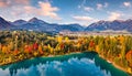 View from flying drone. Breathtaking morning scene of Urisee lake. Aerial view of Reutte town, Austria, Europe. Fantastic sunrise Royalty Free Stock Photo