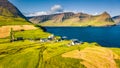 View from flying drone. Bright morning view of Vidareidi Kirkja. Panoramic outdoor scene of Vidoy island. Attractive summer view o