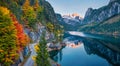 View from flying drone. Colorful autumn view of Gosausee Vorderer lake with Dachstein glacieron background. Gorgeous evening sce