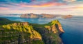View from flying drone. Colorful sunset on Mykines island. Exciting evening view of Alaberg cliffs, Faroe Islands, Kingdom of Denm