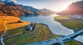 View from flying drone. Exciting autumn scene of Silvaplana village, Maloja Region. Aerial morning view of Swiss Alps. Breathtakin