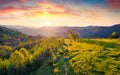 View from flying drone. First sunlight glowing mountain valley at June.