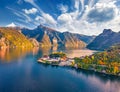 View from flying drone. Gorgeous morning view of Maria Kronung church. Aerial autumn scene of Traunsee lake. Incredible landscape