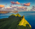 View from flying drone. Great evening scene of Mykines island. Fantastic summer view of Alaberg cliffs, Faroe Islands, Denmark, Eu