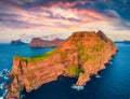 View from flying drone. Incredible sunset on Kallur Lighthouse, Kalsoy island. Unbelievable summer scene of Faroe Islands, Kingdom