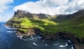 View from flying drone. Majestic morning scene of Mulafossur Waterfall. Stunning summer view of Vagar island, Faroe Islands,