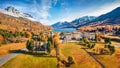 View from flying drone of Maloja village. sunny morning scene of Swiss Alps. Beautiful landscape of Sils lake, Switzerland, Europe Royalty Free Stock Photo