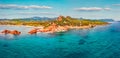 View from flying drone. Panoramic summer view of di Cea beach with Red Rocks Gli Scogli Rossi - Faraglioni. Aerial morning scene o