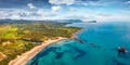 View from flying drone. Panoramic summer view of di Cea beach with Red Rocks Gli Scogli Rossi - Faraglioni. Royalty Free Stock Photo