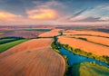 View from flying drone of river in the shape of tree among the field of wheat. Royalty Free Stock Photo
