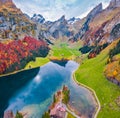 View from flying drone. Splendid morning view of Seealpsee lake. Picturesque autumn scene of Swiss Alps. Santis peak reflected in Royalty Free Stock Photo