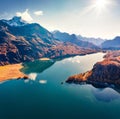 View from flying drone. Sunny morning view of Sils Lake Silsersee. Aerial autumn scene of Swiss Alps, Maloja Region, Upper Engad Royalty Free Stock Photo