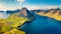 View from flying drone. Sunny summer scene of Vidareidi village, Vidoy island. Amazing morning view of Faroe Islands, Kingdom of D