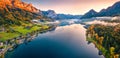 View from flying drone. Unbelievable morning scene of Grundlsee lake. Aerial autumn view of Eastern Alps, Liezen District of Styri