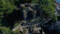 View from flying up drone at the stone ruined building on the beautiful green Taurus Mountains in Gazipasa, Antalya