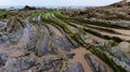 View of Flysch rock formations at low tide at Barrika beach near Bilbao Royalty Free Stock Photo