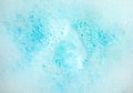 View of foam after dissolving color bath bomb in water