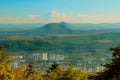 View of foggy city in the valley below the mountain. Caucasus, Pyatigorsk, Russia. Royalty Free Stock Photo