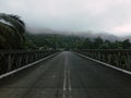 View of foggy morning with hanging bridge from Sungai Lembing