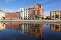 View of Fontanka and profitable houses on the waterfront with their reflection in the water. In the foreground is the profitable h