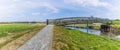 A view of a footbridge over the River Nene with a backdrop of the Irchester viaduct near Wellingborough UK Royalty Free Stock Photo