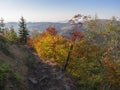 View from footpath on top of Klic or Kleis in Lusatian Mountains or luzicke hory with vivid autumn colored deciduous and Royalty Free Stock Photo